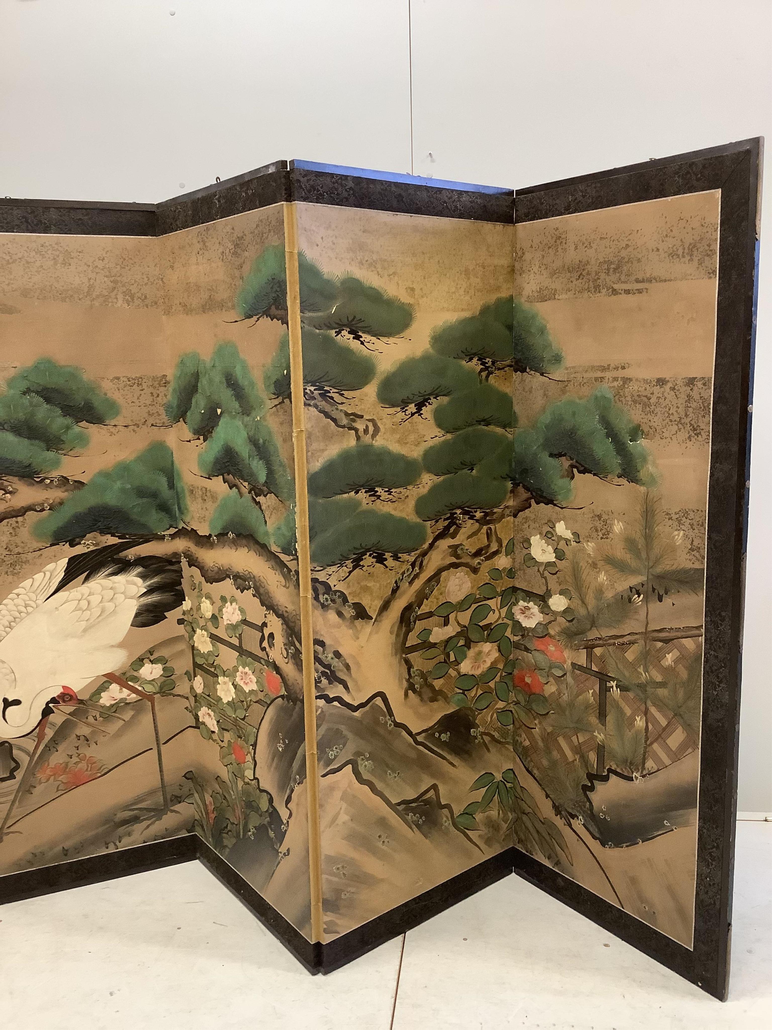 A late 19th century Japanese six section dressing screen, paper laid on frame, decorated with storks in landscape, each panel width 61cm, height 166cm. Condition - fair